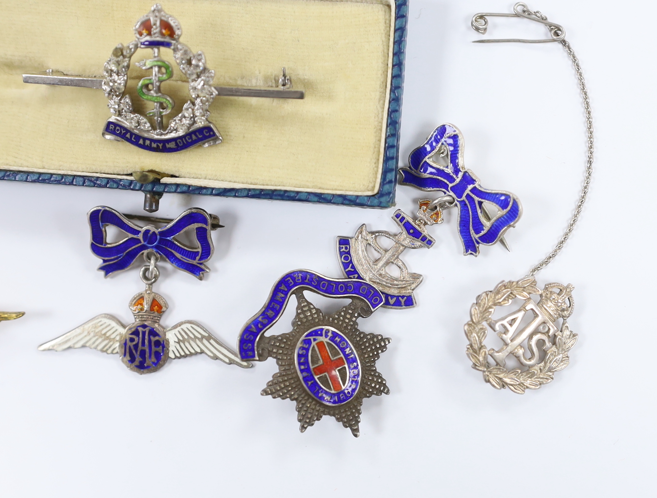 Seven white metal etc. enamelled sweetheart and related brooches, examples including; RAF, Royal Navy, RAMC, Royal Marines, etc.